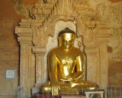 A modern Buddha framed by modern stucco in Htilomino Phaya