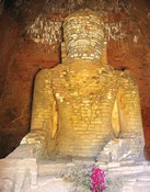 Thandawgya<br>A big Buddha which has lost its stucco detailing, leaving only the Tufa stone from Mt. Popa.