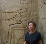 Gloria looks up, ignoring the Pharaoh with the scepter of <em>Was</em>, strength,  in one hand and the <em>Ankh </em> of life in the other.