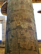 Engraved on the column:  Pharaoh giving feathers to ithyphalic (with an erection) god Min.
