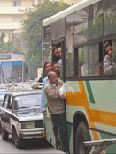 An overstuffed bus, stuck in the awful Cairo traffic