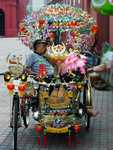 Is this trishaw for passengers or for show?  He's napping in the heart of the tourist district. (398x530, 91.8 kilobytes)