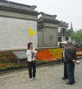 One of the guides awaits her tourists in Zhouzhuang