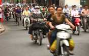 The congested motorcycle/scooter/motorbike/bicycle traffic
