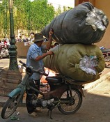 Loading trash outside the An Dong II market