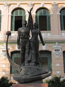 Soviet style statues flank the entrance to the post office.