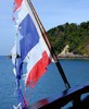 For our cruise to Koh Rok, we had a good sized wooden boat, but with this bedraggled Thai flag. (404x492, 71.9 kilobytes)